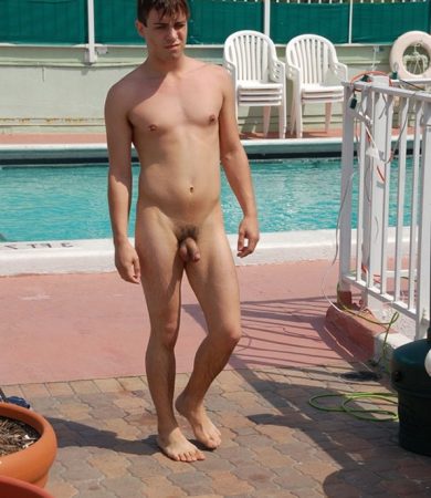 Handsome boy nude in pool