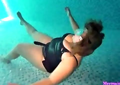 Swimmer girl teases underwater with piece