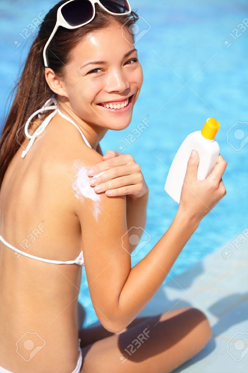Girl putting on bikini