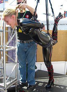 Women in bondage and suspension in boots